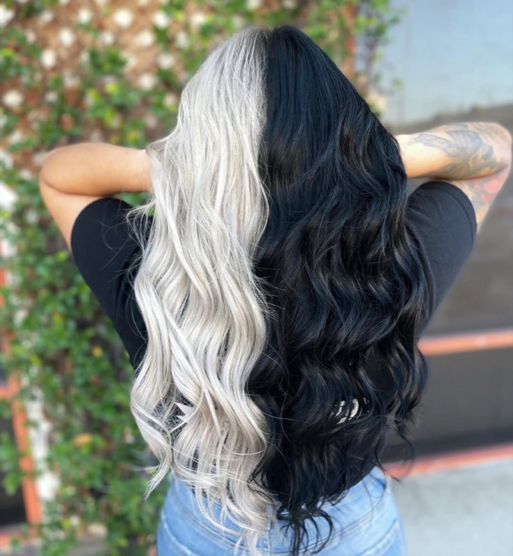 Split-dye waves — platinum blonde on one side, jet black on the other